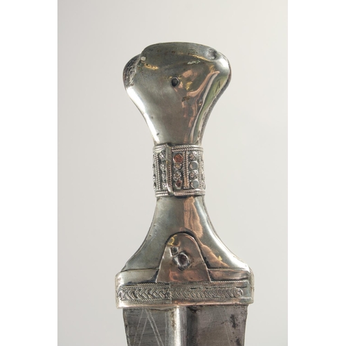 259 - A FINE LARGE 19TH CENTURY RHINO HORN HILTED ARAB YEMENITE SILVER JAMBIYA DAGGER, 34.5cm in sheath.