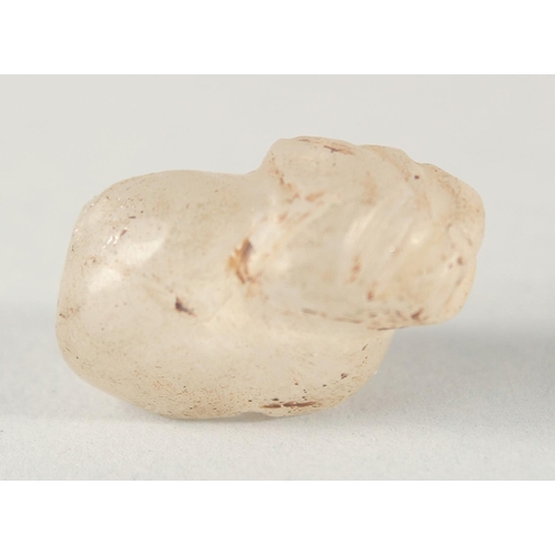 267 - TWO EARLY ISLAMIC CARVED ROCK CRYSTAL ANIMAL FORM BEADS, together with another cat shape bead, (3).