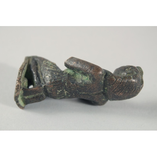 268 - A SMALL EARLY EGYPTIAN BRONZE FIGURE, 6.5cm high.