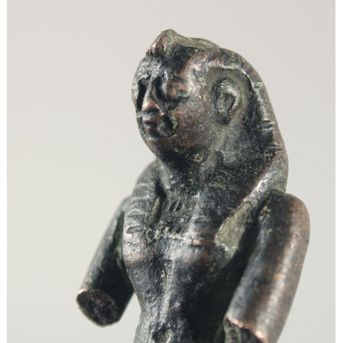 268 - A SMALL EARLY EGYPTIAN BRONZE FIGURE, 6.5cm high.