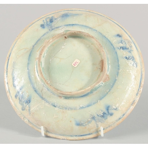 277 - A 15TH CENTURY PERSIAN TIMURID GLAZED POTTERY DISH, with traces of lustre, 22cm diameter.