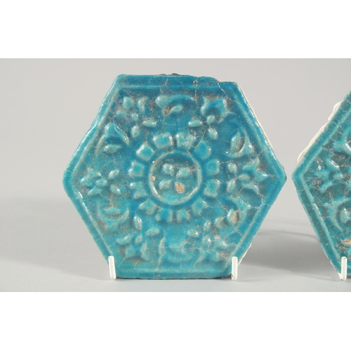 278 - A PAIR OF 13TH CENTURY PERSIAN SELJUK GLAZED POTTERY HEXAGONAL TILES, with raised floral motif decor... 