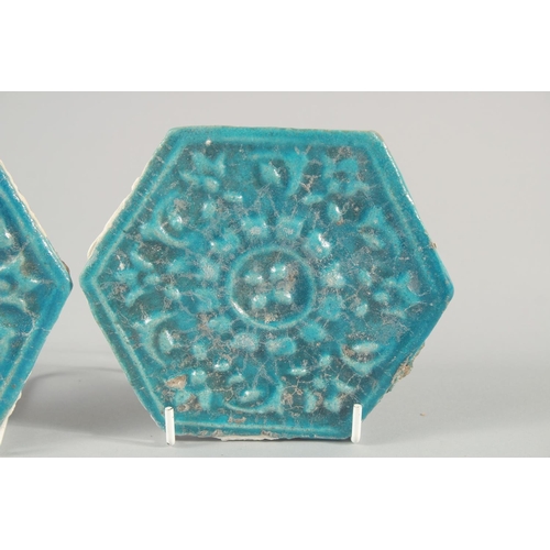 278 - A PAIR OF 13TH CENTURY PERSIAN SELJUK GLAZED POTTERY HEXAGONAL TILES, with raised floral motif decor... 