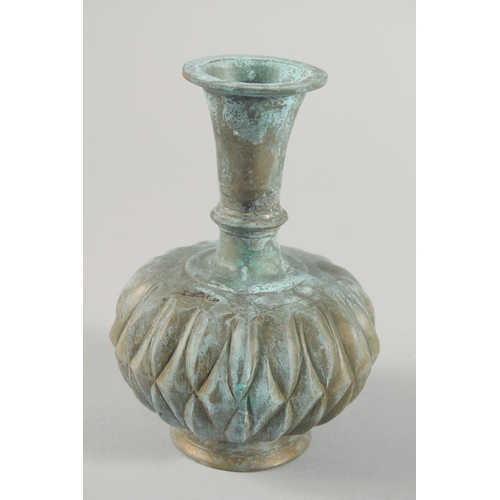 285 - A MUGHAL INDIAN BRASS BOTTLE VASE, 16.5cm high.