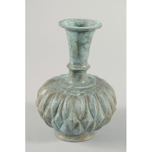 285 - A MUGHAL INDIAN BRASS BOTTLE VASE, 16.5cm high.