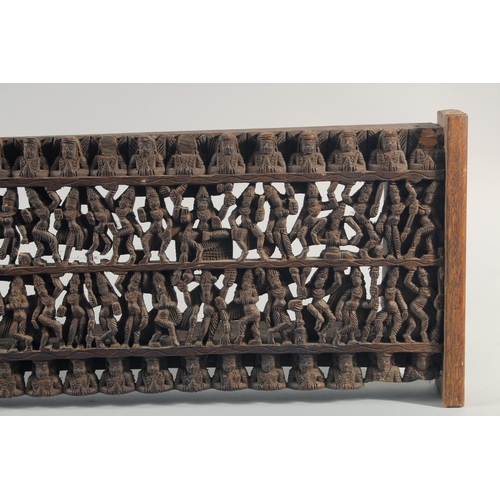 286 - A 19TH CENTURY SOUTH INDIAN CARVED WOODEN PANEL, carved with rows of deities and figures, 97.5cm x 2... 