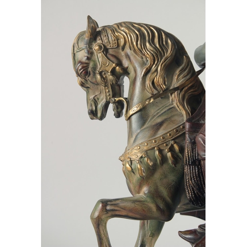 287 - A LARGE 19TH CENTURY ORIENTALIST COLD PAINTED HORSE AND RIDER, mounted to a green marble base, 62cm ... 