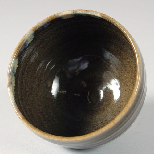 87 - A CONTEMPORARY JAPANESE GLAZED POTTERY BOWL, signed, in original wooden box, bowl 12cm diameter.