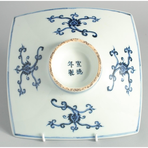 108 - A CHINESE BLUE AND WHITE PORCELAIN SQUARE FORM DISH, decorated with beasts and lotus, the base with ... 