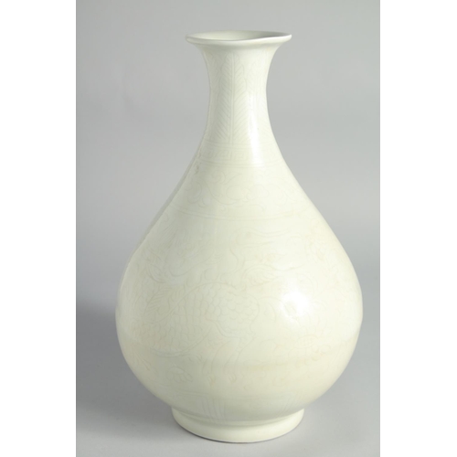 110 - A CHINESE LIGHT-CELADON GLAZED CARVED PHOENIX YUHUCHUNPIN VASE, 32cm high.