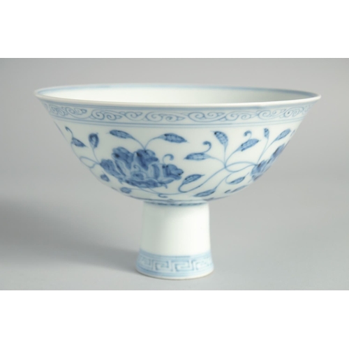 113 - A CHINESE BLUE AND WHITE PORCELAIN STEM CUP, decorated with flowers and vine, with six-character mar... 