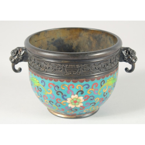 114 - A CHINESE CLOISONNE ENAMELLED BRONZE TWIN HANDLE CENSER, decorated with floral motifs, 19cm wide (ha... 