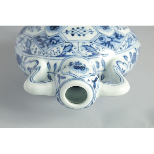 117 - A CHINESE BLUE AND WHITE PORCELAIN TWIN HANDLE MOONFLASK, decorated with floral panels, 28.5cm high.