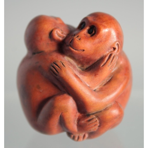 121 - A JAPANESE BOXWOOD NETSUKE OF MONKEYS.