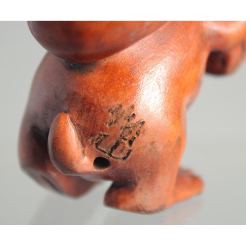 123 - A JAPANESE BOXWOOD NETSUKE OF A RABBIT.