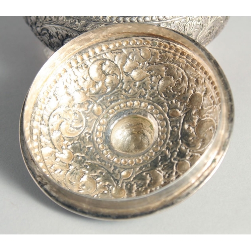 15 - AN CAMBODIAN SILVER CIRCULAR LIDDED BOX, with embossed and engraved foliate decoration, stamped to b... 