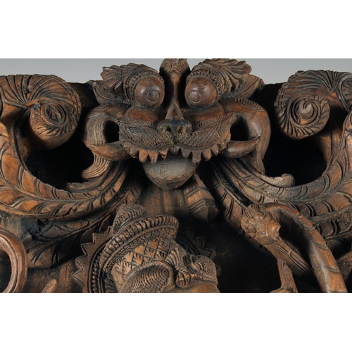 18 - A LARGE INDIAN CARVED WOOD PANEL OF GANESH, 76.5cm x 37cm.