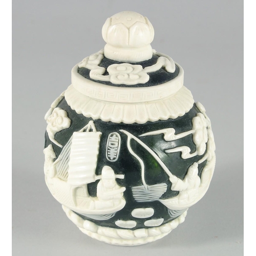 2 - A SMALL CHINESE GREEN GLASS JAR with raised decoration of boating scenes and figures, bearing two ch... 