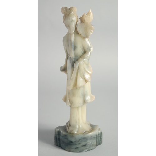 26 - A CHINESE CARVED JADE FIGURE OF GUANYIN, 29cm high.