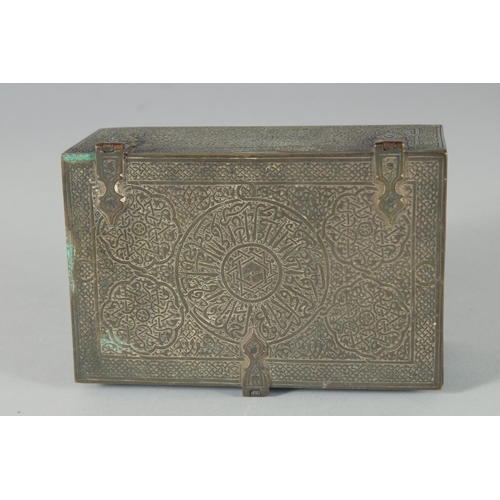 301 - A 19TH CENTURY SYRIAN DAMASCUS ENGRAVED BRASS QURAN BOX, with panels of calligraphy, 14cm x 9cm.