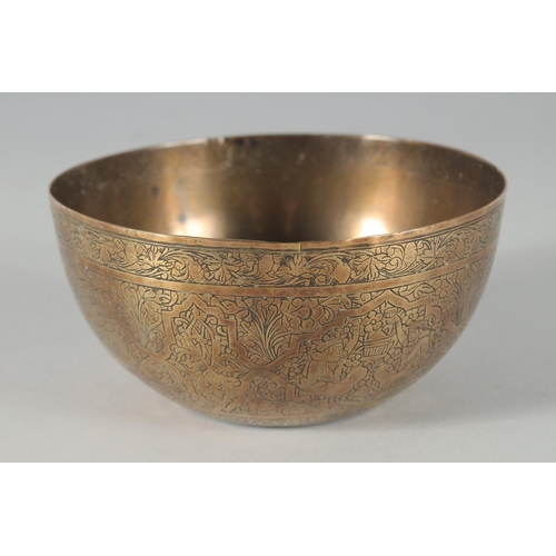 302 - A 19TH CENTURY PERSIAN QAJAR ENGRAVED BRASS BOWL, 12.5cm diameter.