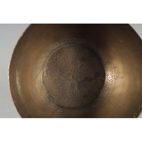 302 - A 19TH CENTURY PERSIAN QAJAR ENGRAVED BRASS BOWL, 12.5cm diameter.