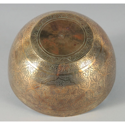 302 - A 19TH CENTURY PERSIAN QAJAR ENGRAVED BRASS BOWL, 12.5cm diameter.