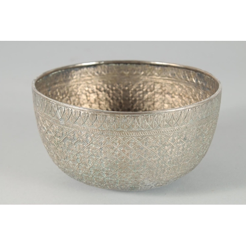 304 - A FINE 19TH CENTURY THAI WHITE METAL BOWL, with embossed and engraved floral motifs, 14.5cm diameter... 