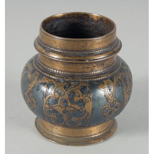 306 - AN EARLY ISLAMIC - POSSIBLY AYYUBID, WHITE METAL INLAID BRONZE INKWELL, 5.5cm high.