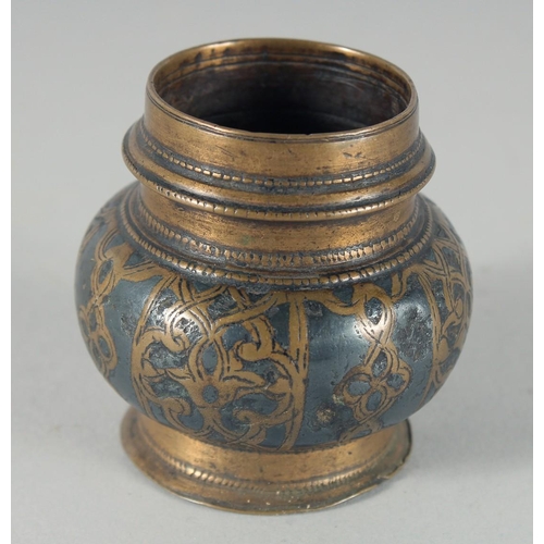 306 - AN EARLY ISLAMIC - POSSIBLY AYYUBID, WHITE METAL INLAID BRONZE INKWELL, 5.5cm high.