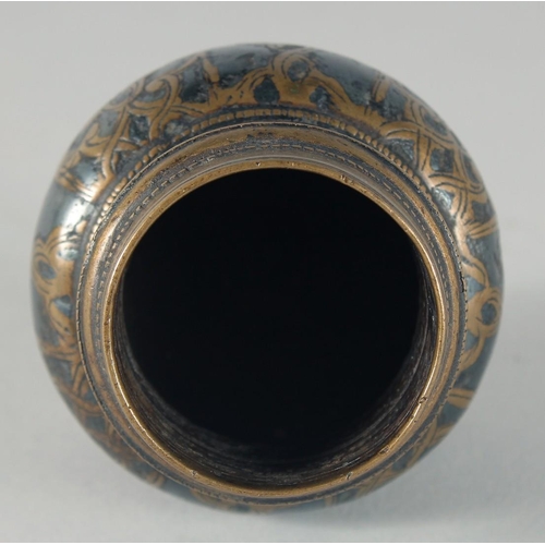 306 - AN EARLY ISLAMIC - POSSIBLY AYYUBID, WHITE METAL INLAID BRONZE INKWELL, 5.5cm high.