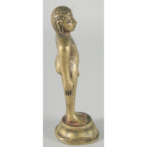 307 - A FINE 18TH-19TH CENTURY INDIAN BRASS JAIN FIGURE, 16cm high.