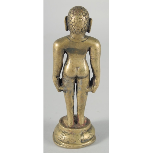 307 - A FINE 18TH-19TH CENTURY INDIAN BRASS JAIN FIGURE, 16cm high.