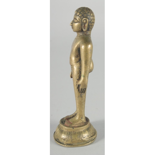 307 - A FINE 18TH-19TH CENTURY INDIAN BRASS JAIN FIGURE, 16cm high.