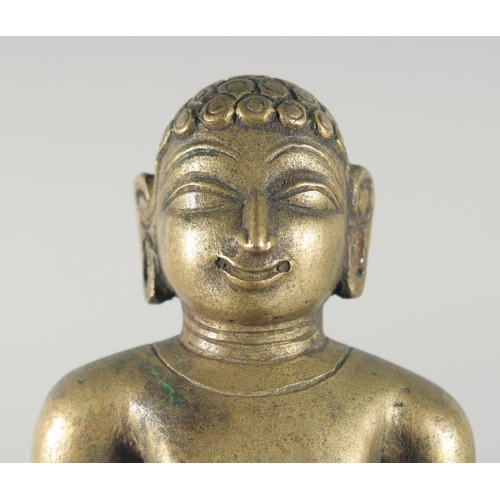 307 - A FINE 18TH-19TH CENTURY INDIAN BRASS JAIN FIGURE, 16cm high.