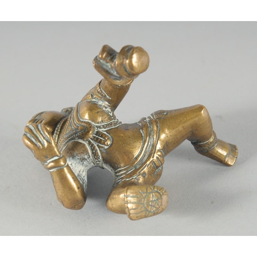 308 - A 19TH CENTURY INDIAN BRASS FIGURE OF CRAWLING KRISHNA, 8cm high.