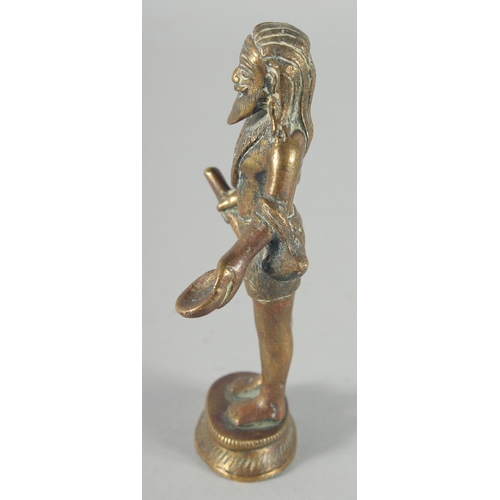 310 - A 19TH CENTURY INDIAN BRASS FIGURE OF SADHU, 13cm high.