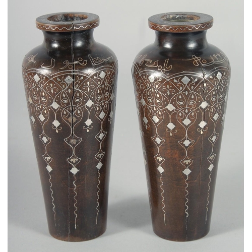 317 - A FINE PAIR OF OTTOMAN TURKISH SILVER INLAID WOODEN VASES, signed, 16.5cm high.