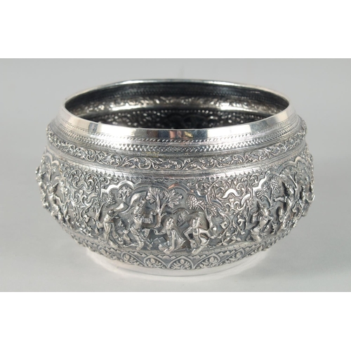 318 - A FINE 19TH CENTURY BURMESE SILVER BOWL, relief-decorated with scenes of multiple figures, weight 58... 