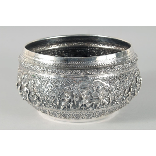 318 - A FINE 19TH CENTURY BURMESE SILVER BOWL, relief-decorated with scenes of multiple figures, weight 58... 