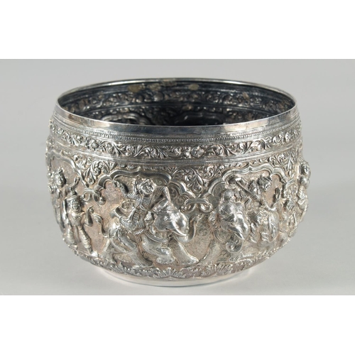 319 - A VERY FINE AND LARGE 19TH CENTURY BURMESE SILVER BOWL, relief-decorated with figures and animals, w... 