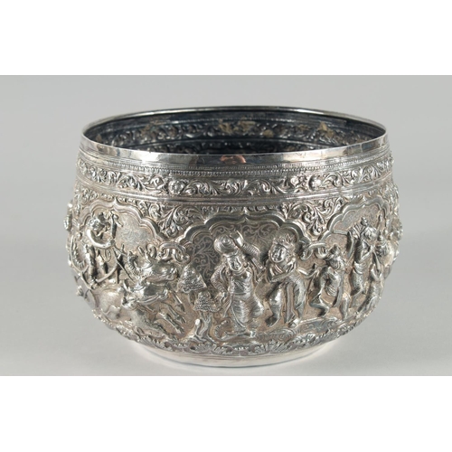 319 - A VERY FINE AND LARGE 19TH CENTURY BURMESE SILVER BOWL, relief-decorated with figures and animals, w... 