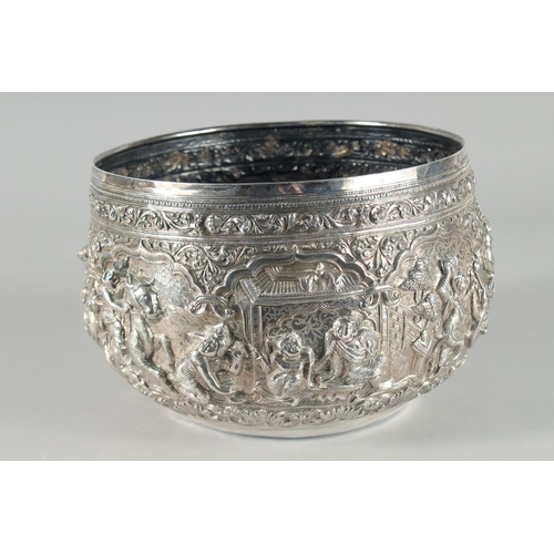 319 - A VERY FINE AND LARGE 19TH CENTURY BURMESE SILVER BOWL, relief-decorated with figures and animals, w... 