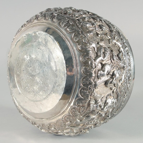 319 - A VERY FINE AND LARGE 19TH CENTURY BURMESE SILVER BOWL, relief-decorated with figures and animals, w... 