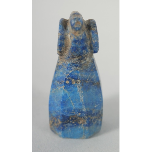 324 - A RARE EARLY ISLAMIC CARVED LAPIS LAZULI CHESS PIECE, 5cm.