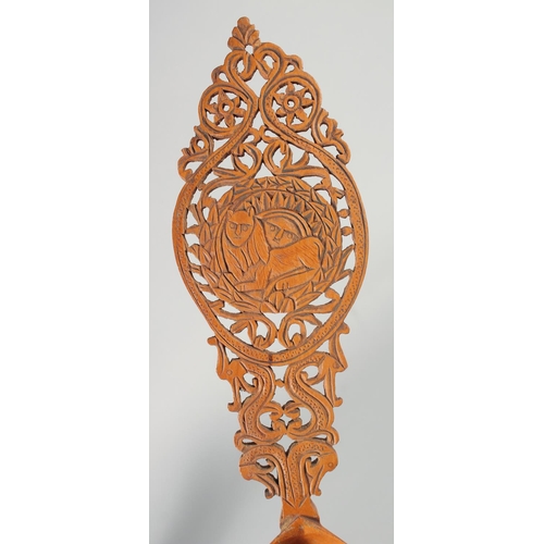 331 - A 19TH CENTURY PERSIAN QAJAR CARVED FRUIT WOOD SHERBET SPOON, 28cm long.