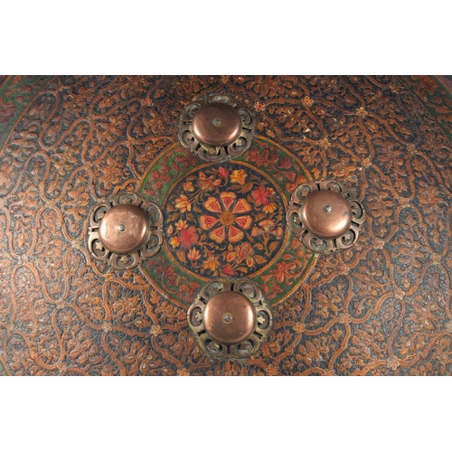 338 - A FINE EARLY 19TH CENTURY NORTH INDIAN MUGHAL LACQUERED AND PAINTED LEATHER SHIELD, with embossed de... 