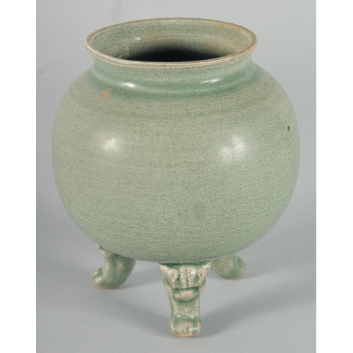 34 - A CHINESE CELADON GLAZE POTTERY BOWL, raised on three moulded legs, 15cm high, together with a small... 