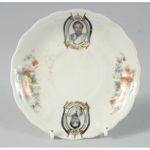 345 - TWO SIGNED IRAQI PORCELAIN ITEMS DEPICTING KING FAISAL, bowl 18cm diameter, saucer 13cm diameter, (2... 