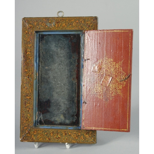 358 - A PERSIAN QAJAR LACQUER CASED MIRROR, the hinged cover painted with a scene including a dancer and m... 